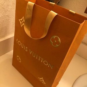 Louis Vitton shopping bag.